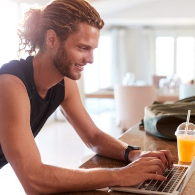 millennial-white-man-checking-fitness-app-on-lapto-9WV83CN-onsad1w5qib0grvl30r0bzd3fremwq96n6g65uo2ao