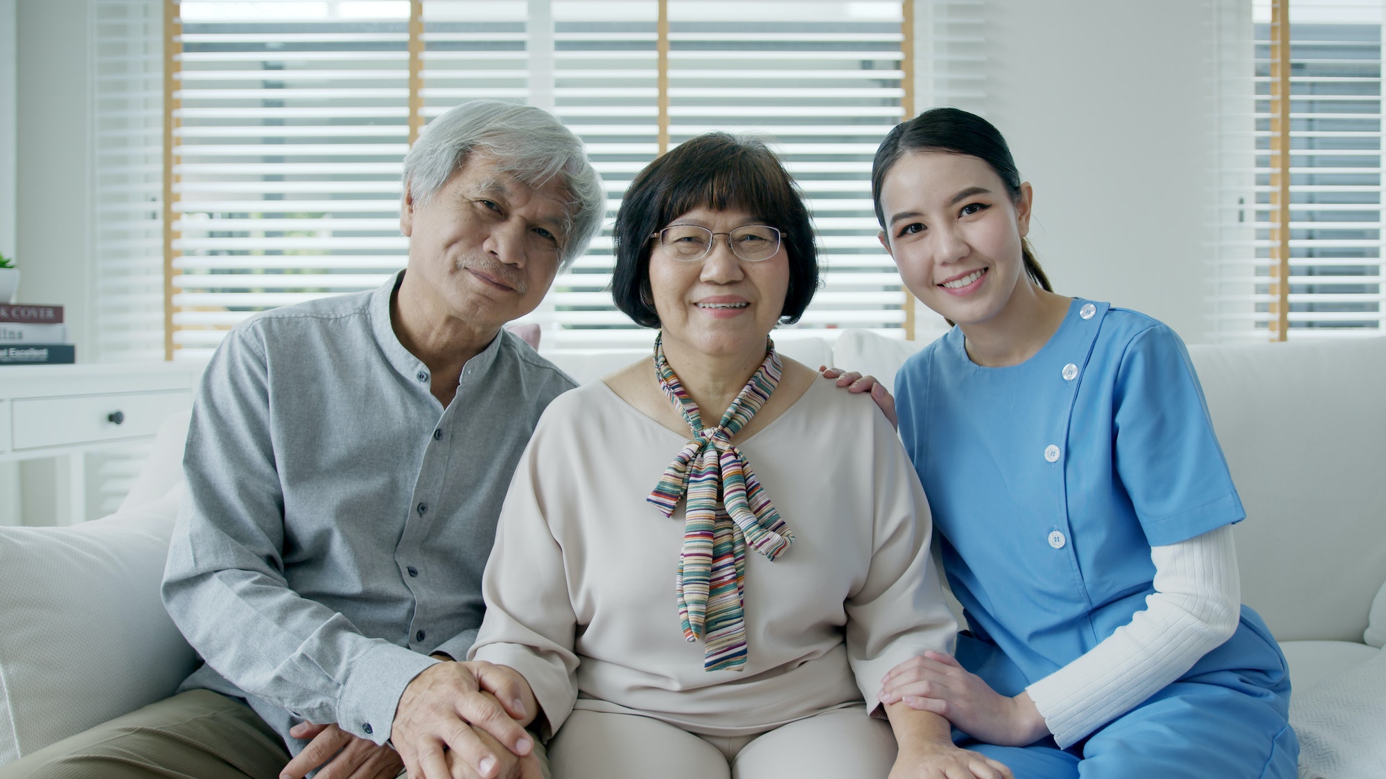 portrait-group-shot-of-happy-senior-asian-couple-with-in-home-nursing-care